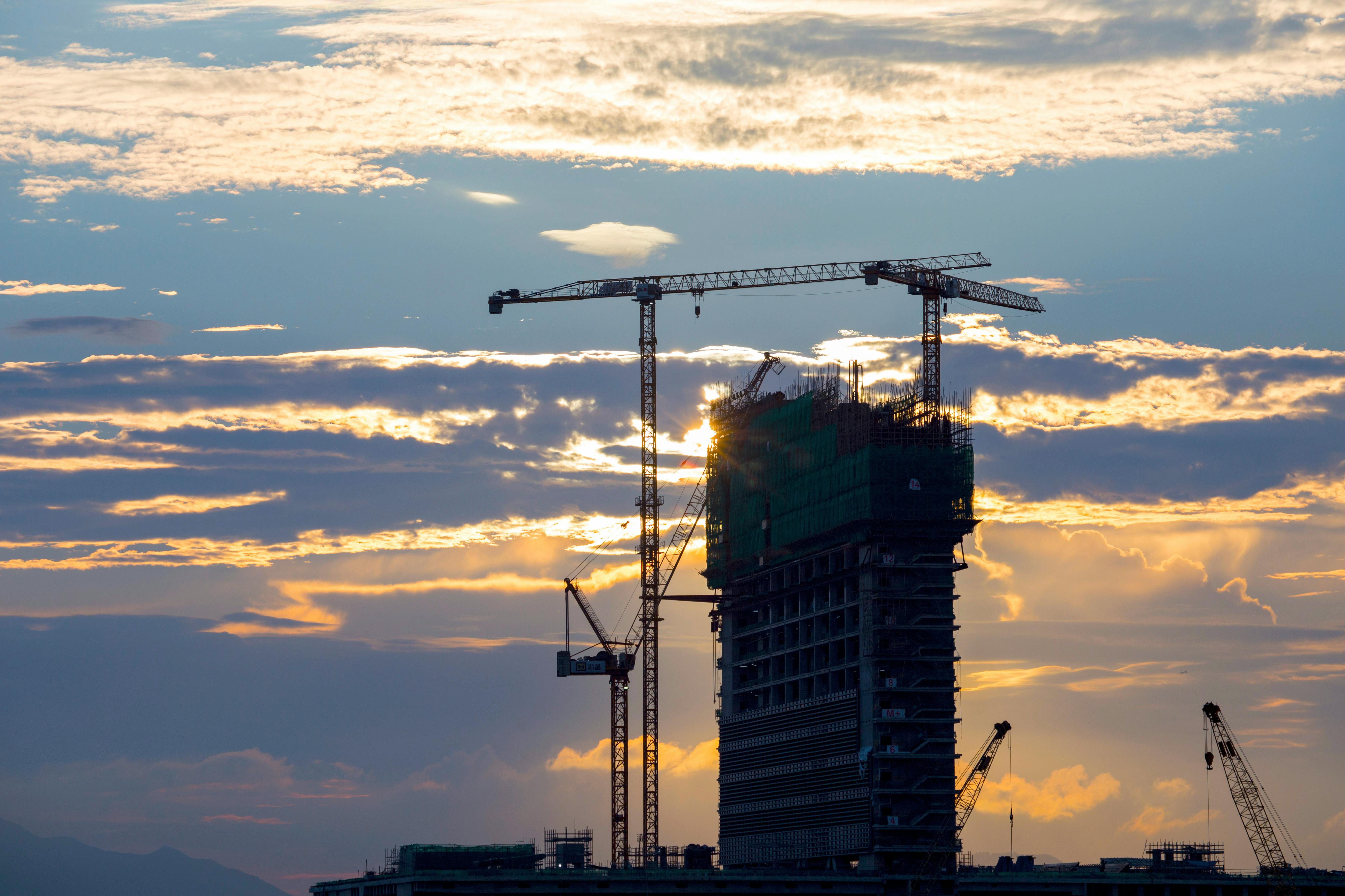 Construction site with cranes and high-rise buildings
