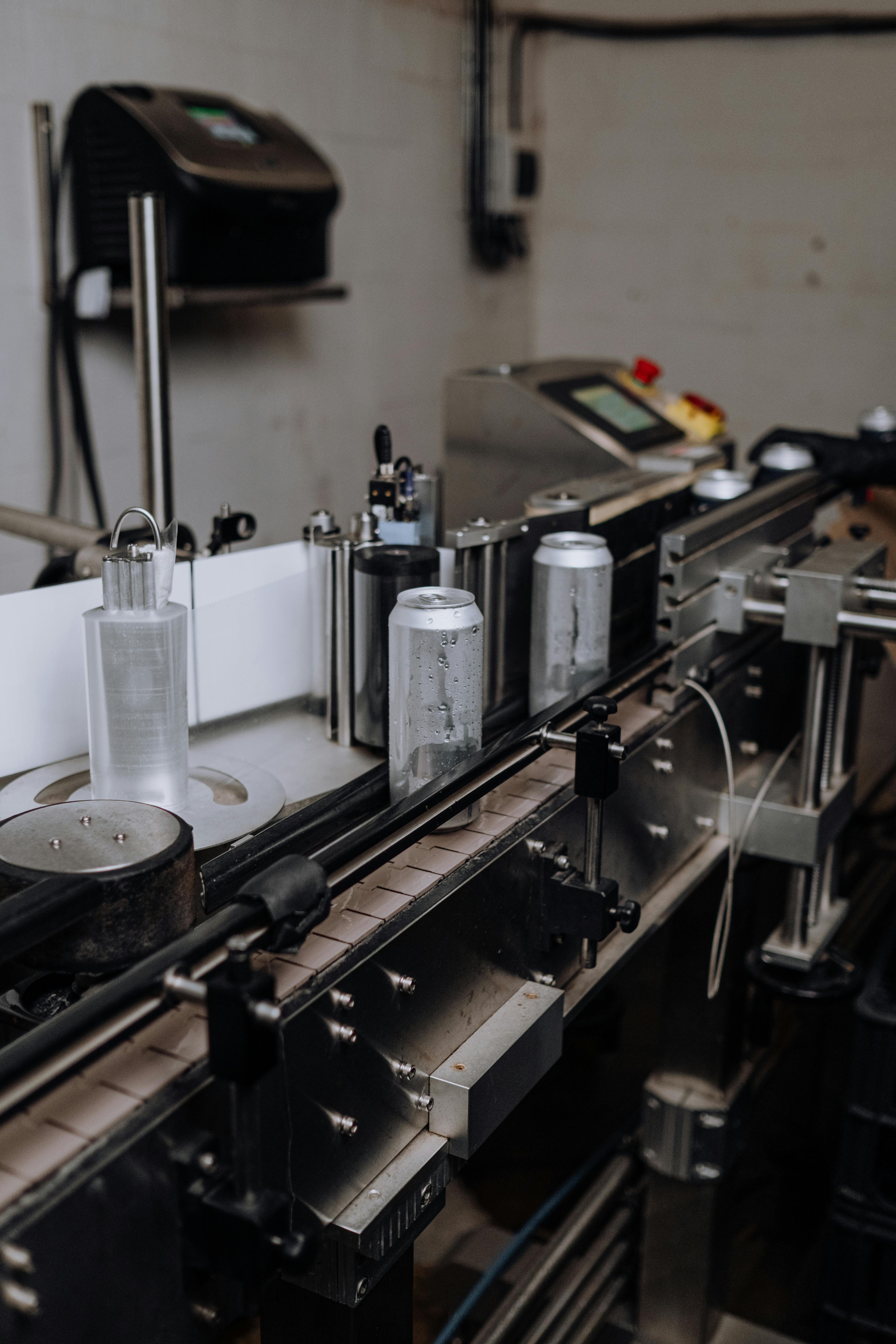 Operator monitoring an automated packaging line